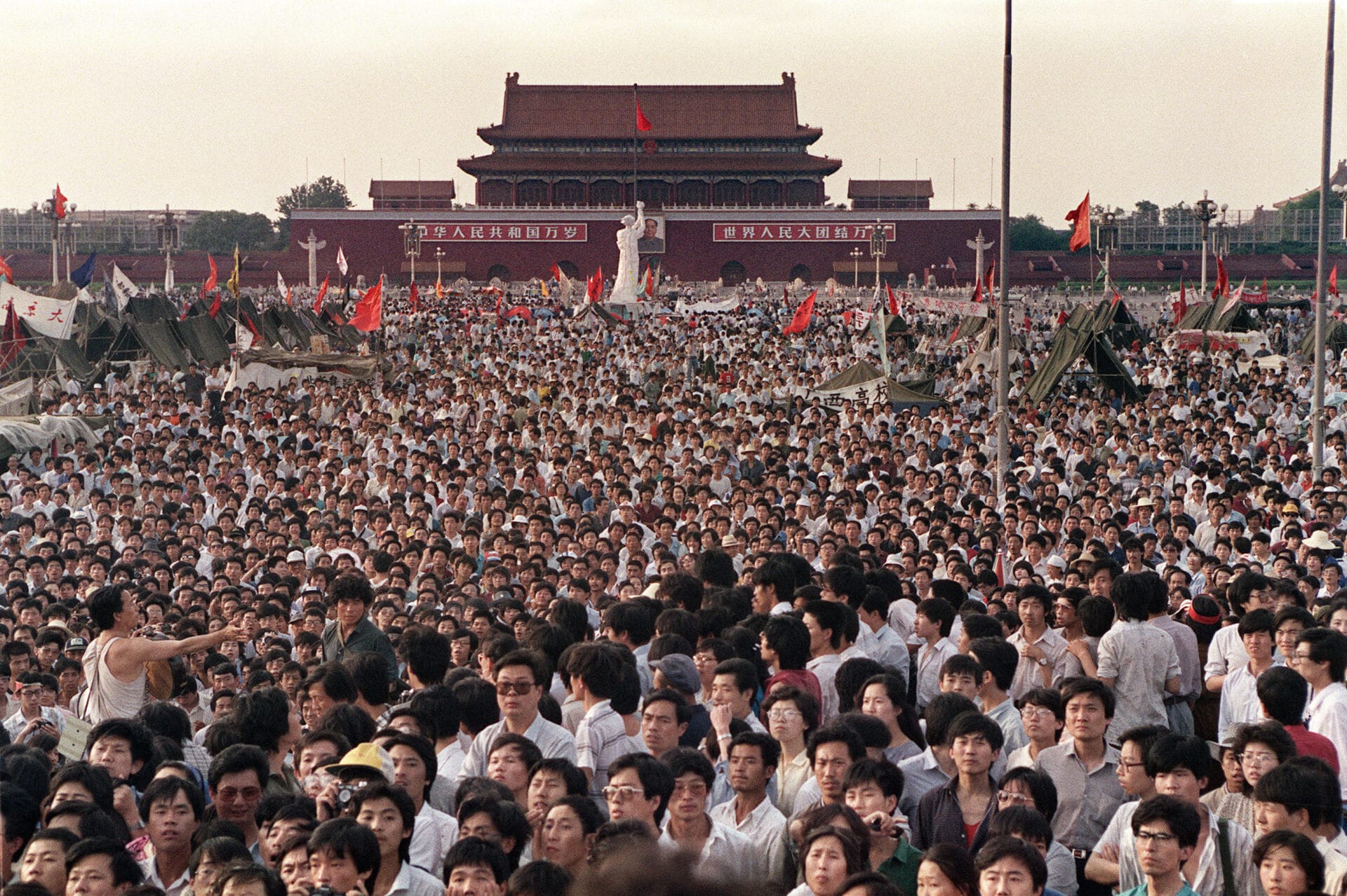 Hundreds of thousands of Chinese gather on June 2, 1989 in Tiananmen Square around a 10-metre replica of the Statue of Liberty (C), called the Goddess of Democracy, demanding democracy despite martial law in Beijing. Hundreds, possibly thousands, of protesters were killed by China's military on June 3 and 4, 1989, as communist leaders ordered an end to six weeks of unprecedented democracy protests in the heart of the Chinese capital. Dissidents and human rights advocates around the world will mark on June 4, 2009 the twentieth anniversary of China's bloody crackdown on the pro-democracy protests. (Photo by CATHERINE HENRIETTE / AFP)